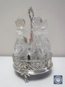 A silver five piece cut crystal cruet set with stand CONDITION REPORT: One glass