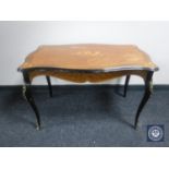 A shaped Kingwood coffee table with gilt metal mounts