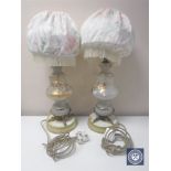 A pair of Victorian glass and metal table lamps with shades and hand painted decoration