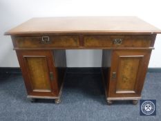 A continental mahogany twin pedestal desk