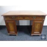 A continental mahogany twin pedestal desk