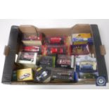 A box containing a collection of die cast vehicles, emergency response vehicles, Dinky,