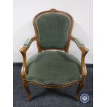 A continental salon armchair in green dralon