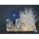 A pair of crystal decanters together with champagne flutes etc.