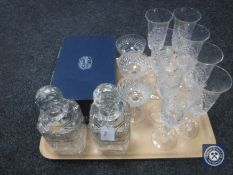 A pair of crystal decanters together with champagne flutes etc.