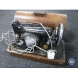 A Singer sewing machine in case
