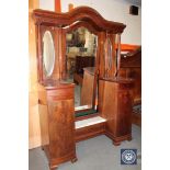 An antique continental mahogany sunk centre dressing table with pillar supports