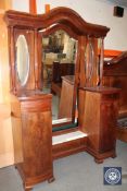 An antique continental mahogany sunk centre dressing table with pillar supports