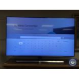 A Samsung 55" smart TV with remote control, model UE55NU8000TXXU.
