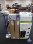 A bread maker together with an air cooler/heater/purifier, floor lamp,