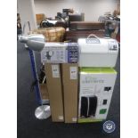 A bread maker together with an air cooler/heater/purifier, floor lamp,