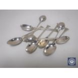 Nine silver teaspoons.