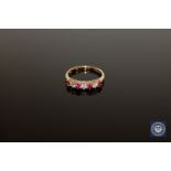 A 9ct gold ruby and diamond half-eternity ring,