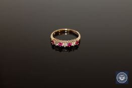 A 9ct gold ruby and diamond half-eternity ring,