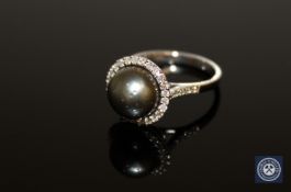 A 14ct yellow gold pearl and diamond ring,