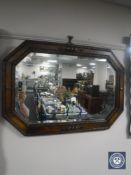 An Edwardian oak bevelled mirror