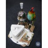 A tray of large butter dish, metal bird, ornate table lamp,