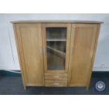 A contemporary oak triple door sideboard