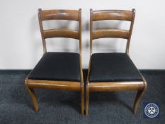 A pair of antique mahogany dining chairs