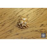 A 9ct gold cultured pearl leaf brooch CONDITION REPORT: 2.