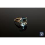 A 9ct gold ring set with a large topaz,