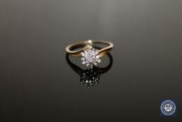 A diamond set cluster ring, size T CONDITION REPORT: 2.