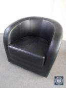 A black leather tub chair