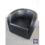 A black leather tub chair