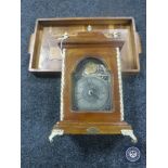 A reproduction mantel clock together with an inlaid wooden tray