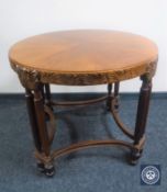 A circular carved mahogany occasional table
