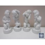 Four Bing & Grondahl figures of children in white glaze, height 11.