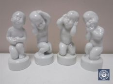 Four Bing & Grondahl figures of children in white glaze, height 11.