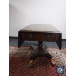 A Victorian mahogany pedestal Sutherland table with lion mask handles