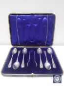 A set of six silver teaspoons and sugar tongs in case