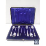 A set of six silver teaspoons and sugar tongs in case