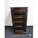 A Victorian glazed door music cabinet