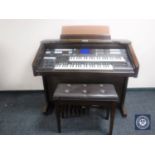 A Technics electric organ with stool