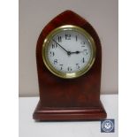 An inlaid mahogany mantel clock with key