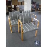 Three 20th century beech framed armchairs in grey striped fabric