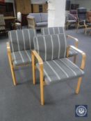 Three 20th century beech framed armchairs in grey striped fabric