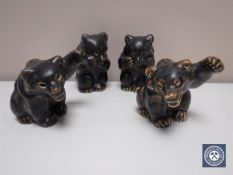 Four Royal Copenhagen figures of bear cubs in mottled brown glaze,