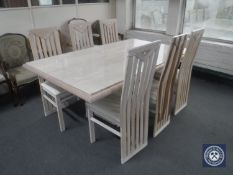 A wood framed marble topped pedestal dining table and six high back chairs (one damaged)