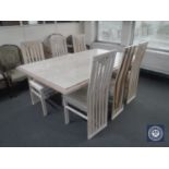 A wood framed marble topped pedestal dining table and six high back chairs (one damaged)