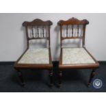 A pair of antique mahogany dining chairs