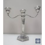 A silver three-way candelabrum