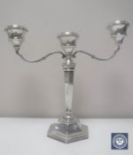 A silver three-way candelabrum