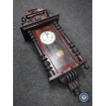 A Victorian mahogany wall clock with enamel dial,