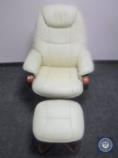 A swivel relaxer chair and stool in cream leather
