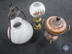 A copper samovar together with a ship's lamp with glass shade and a brass oil lamp