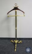 A brass valet stand